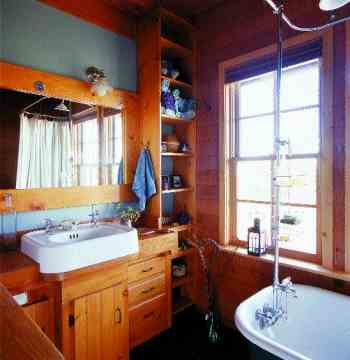
A 1930s sink from a second-hand store and a claw-foot tub (purportedly from a local brothel) furnish the middle-floor bathroom.
